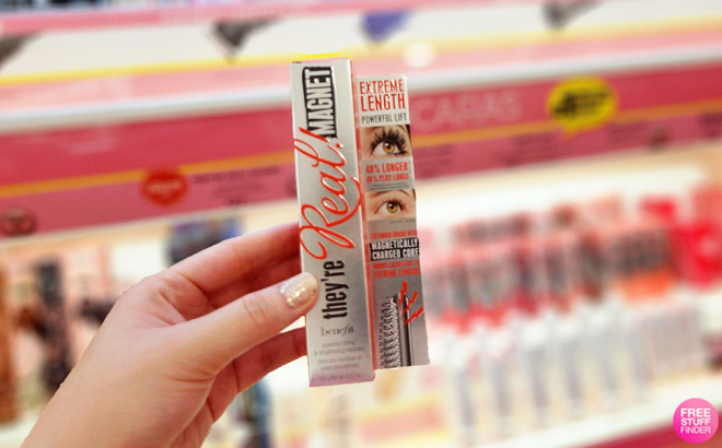 A Hand Holding a Benefit Theyre Real Magnet Extreme Lengthening Mascara