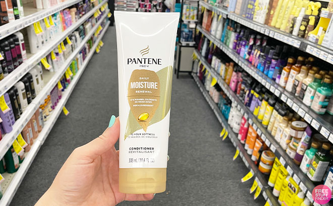 A Hand Holding a Pantene Pro V Daily Moisture Renewal Conditioner