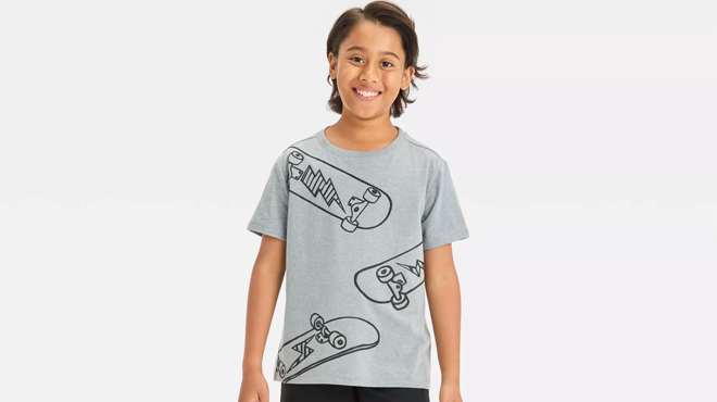 A Kid Wearing Cat Jack Skateboards and Lightning Bolts Tee