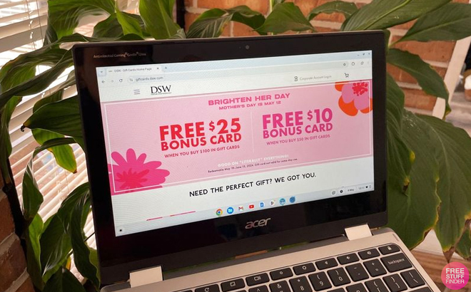 A Laptop Screen Showing the ree 10 bonus card when you buy 50 or a free 25 bonus card when you spend 100 in gift cards Sale at DSW