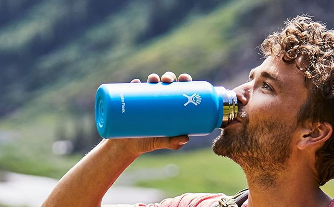 A Man Using a Hydro Flask Bottle to Drink