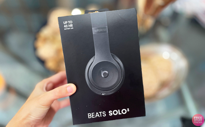 A Person Holding Beats Solo 3 Headphones