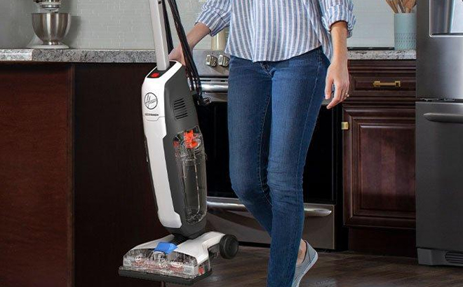 A Person Holding a Hoover PowerDash Hard Floor Cleaner