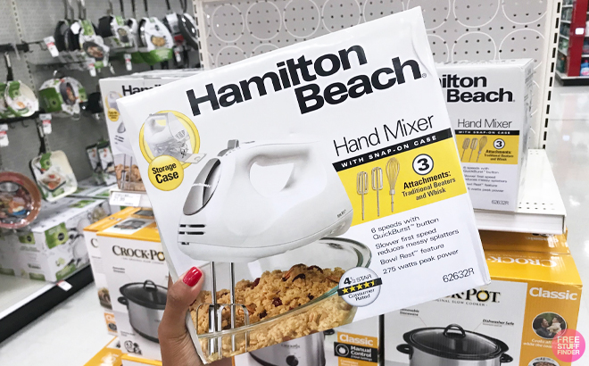 A Person Holding the Hamilton Beach 6 Speed Hand Mixer with Case