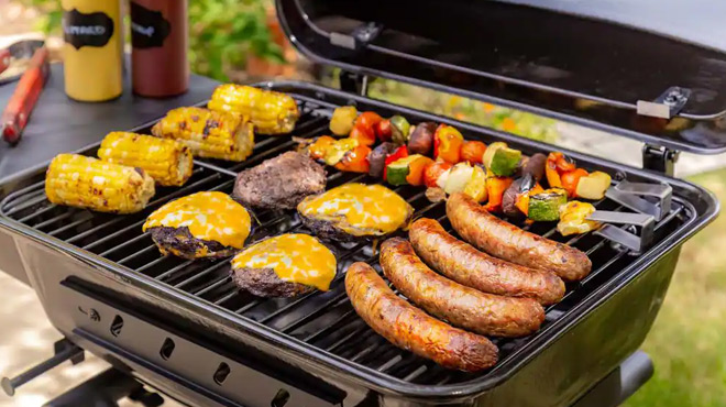 A Variety of Food Getting Grilled on the Dyna Glo Portable Charcoal Grill