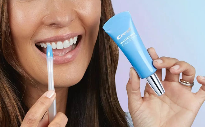 A Woman Using a Crest Daily Whitening Serum Mint