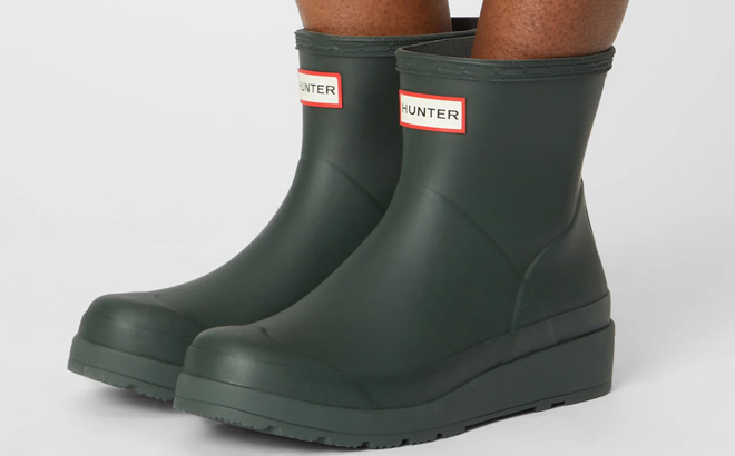 A Woman Wearing Hunter Womens Play Short Boots in Arctis Moss Color