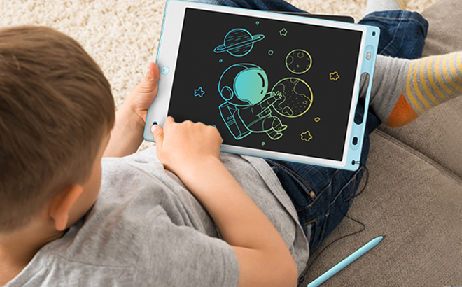 Boy Drawing on the LCD Kids Writing Tablet in Blue Color
