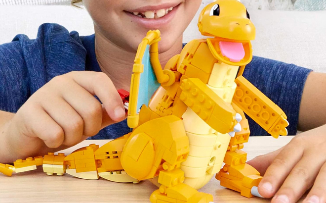 Boy Playing with Mega Pokemon Dragonite 388 Piece Action Figure Building Set