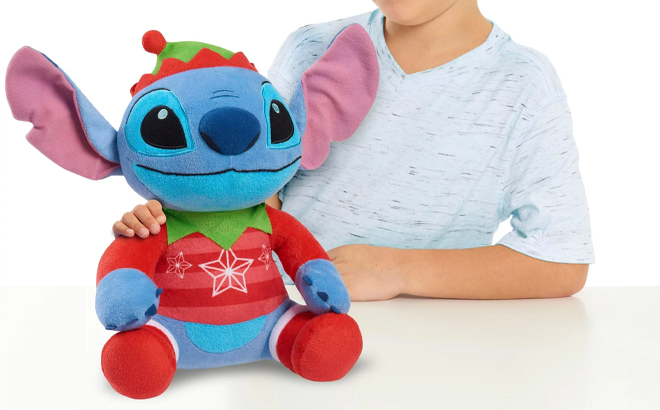 Child Holding the Disney Stitch Holiday Large 11 inch Plush Stuffed Animal