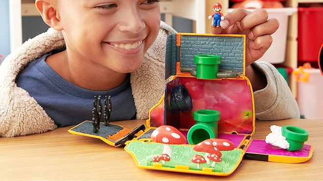 Child playing the Super Mario Bros Movie Van Playset with Figure Child playing the Super Mario Bros Movie Van Playset with Figure
