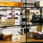 Different Tory Burch Bags on a Shelf