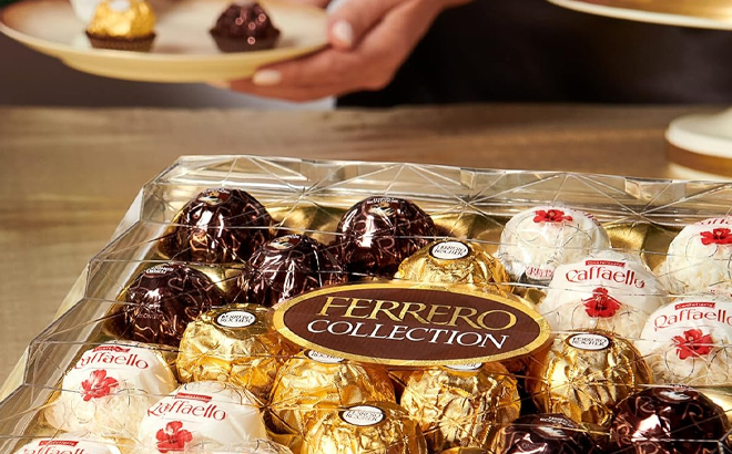 Ferrero Rocher 24 Count Assorted Gift Box on a Table with people eating them in the background