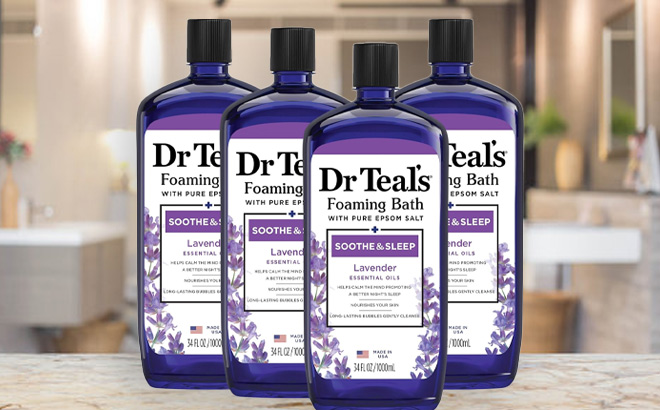 Four Bottles of Dr Teals Lavander Foaming Bath on Desk