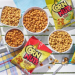 Four Bowls and Packs of Corn Nuts Snacks on a Table