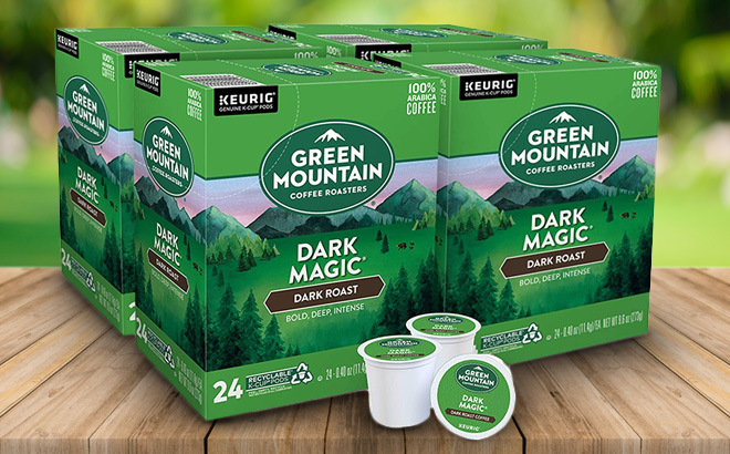 Four Boxes of Keurig Green Mountain Dark Magic Coffee 24 Packs on a Wooden Table