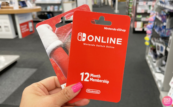 HAnd Holding a Nintendo Switch Online 12 Month Individual Membership Gift Card