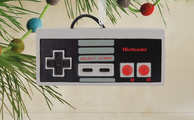 Hallmark Nintendo Entertainment System Controller Ornament Hanging from a Tree