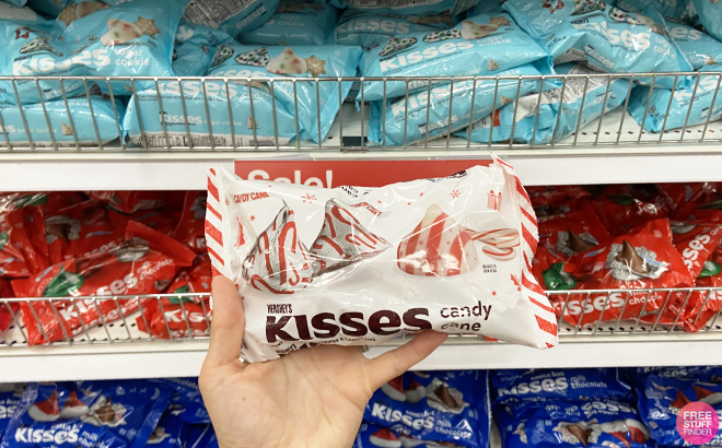 Hand Holding Hersheys Kisses Candy Cane Christmas Candy Bag