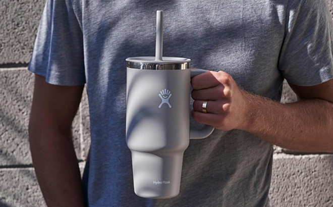 Hand Holding Hydro Flask All Around Travel Tumbler with Handle Stainless Steel Double Wall Vacuum Insulated