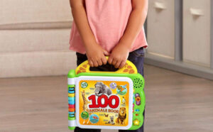 Hand Holding LeapFrog 100 Animals Book