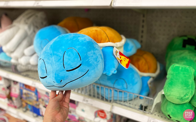 Hand Holding Pokemon Squirtle Kids Plush Sleeping Buddy in Store