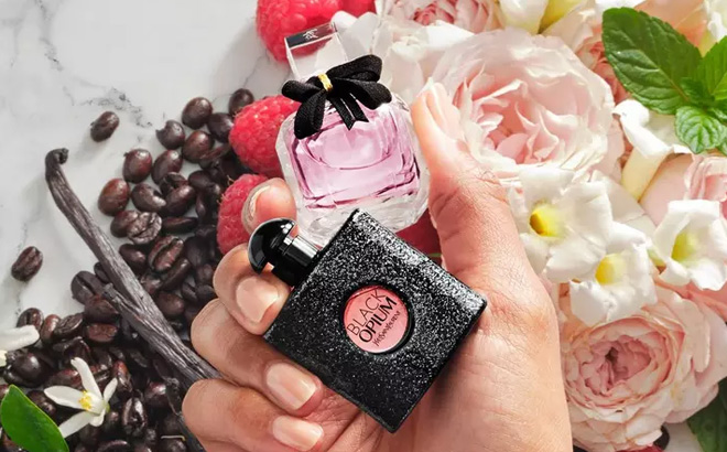 Hand Holding Yves Saint Laurent Feminine Fragrances Hand Holding Yves Saint Laurent Feminine Fragrances