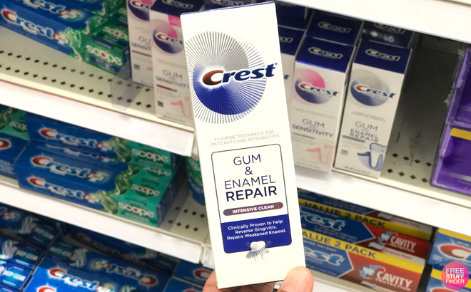 Hand Holding a Crest Pro Health Gum and Enamel Repair