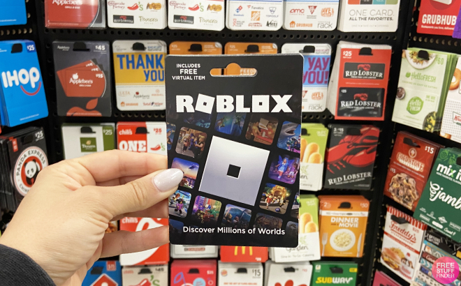 Hand Holding a Roblox Gift Card