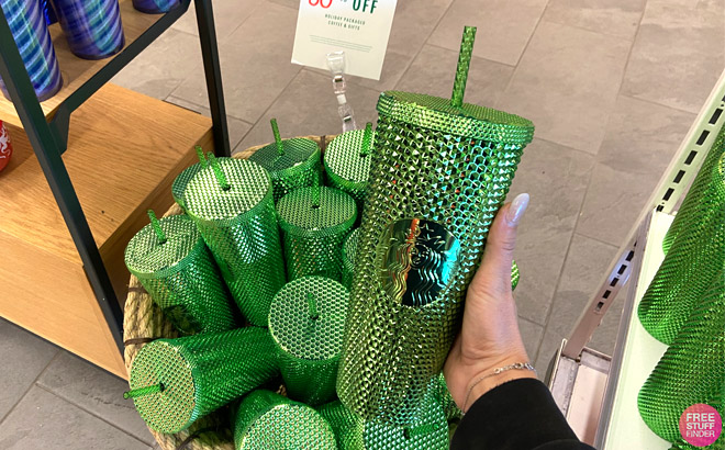 Hand Holding a Starbucks Green Cold Cup