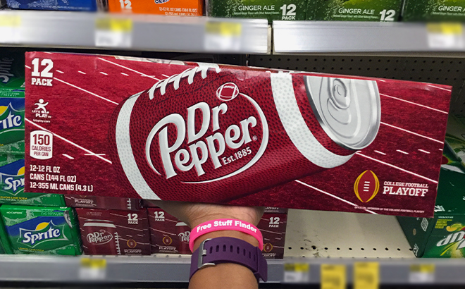 Hand holding Dr Pepper Soda