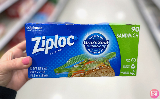 Hand holding Ziploc 90 Count Sandwich and Snack Bag