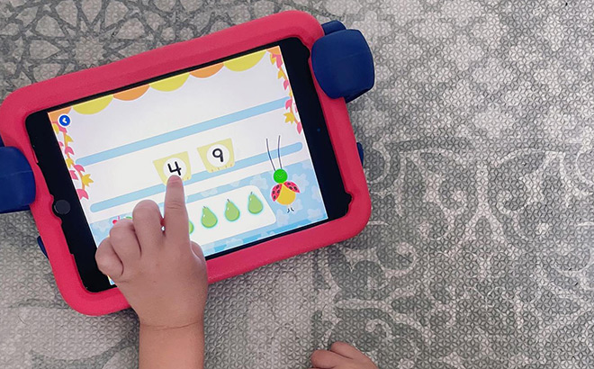 Kid Playing an Interactive Game on a Tablet