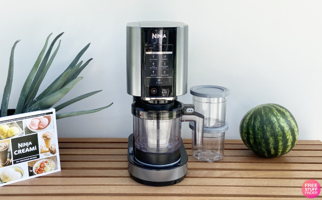 Ninja CREAMi Ice Cream Maker on a Wooden Counter