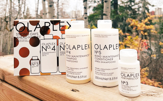Olaplex Strong Days Ahead Hair Kit on a Wooden Bench