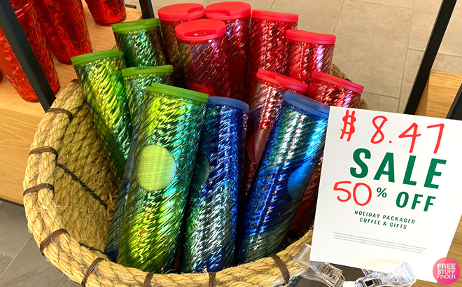 Starbucks Tumblers on a Store Basket