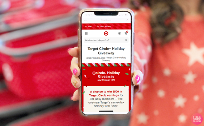 Tina Holding a Phone with Target Circle Holiday Giveaway Details