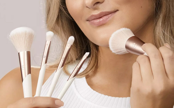 Woman Holding EcoTools Luxe Natural Elegance Face Makeup Brush Kit