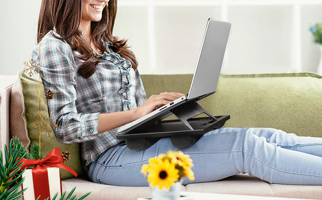 Woman Working on a Lapton Thats Positioned on the Huanuo Adjustable Laptop Stand