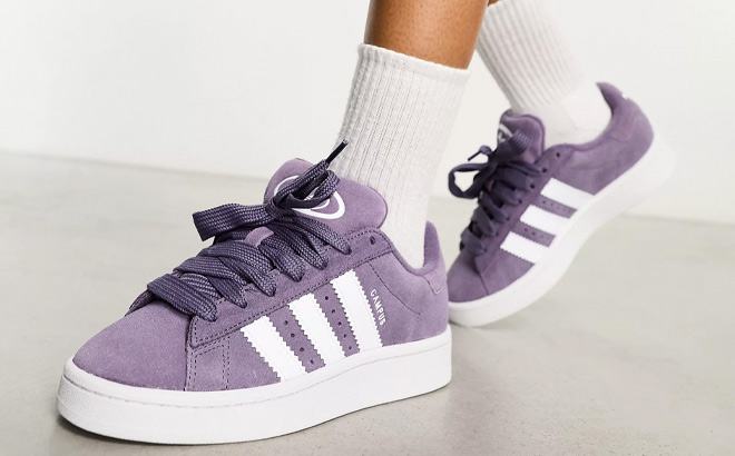 Woman is Wearing Adidas Original Campus Sneakers in Purple and White Color