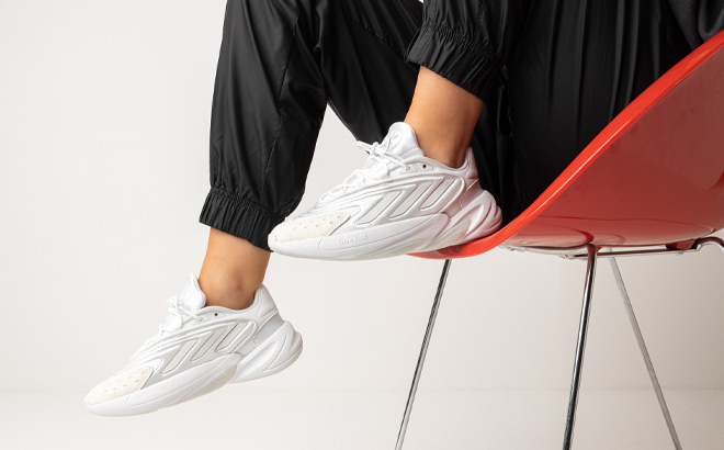 Woman is Wearing Adidas Originals Ozelia Sneakers in White Color