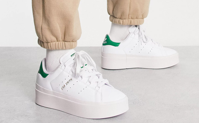 Woman is Wearing Adidas Originals Stan Smith Bonega Platform Sneakers in White and Green Color