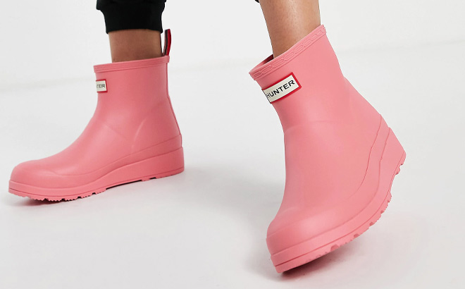 Woman is Wearing Hunter Play Short Boot in Pink Color