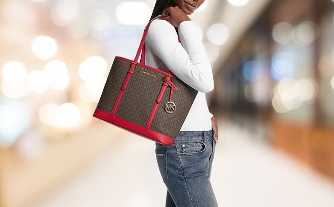 Woman is Wearing Michael Kors Jet Set Travel Small Logo Top Zip Tote Bag in Bright Red Color