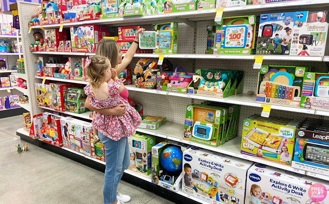 Woman with child checking out toys on the shelf at Target