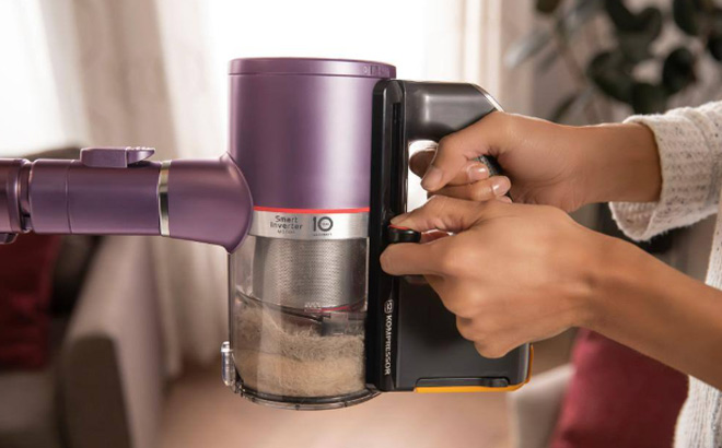 Women Holding LG Cordless Stick Vacuum 1