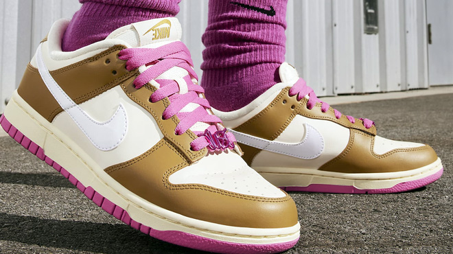Women Wearing Nike Pink and Bronzine Dunk Low Shoes