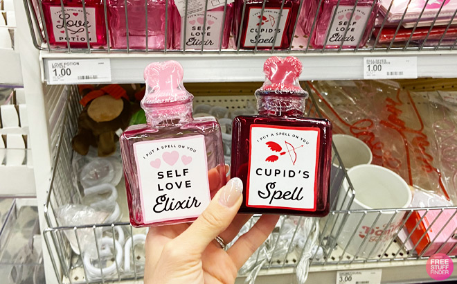 a Hand Holding Love Potion Bottles