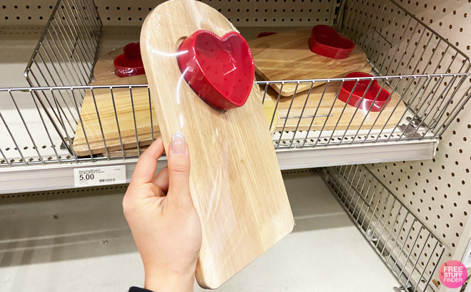 a Hand Holding Valentines Day Serving Board