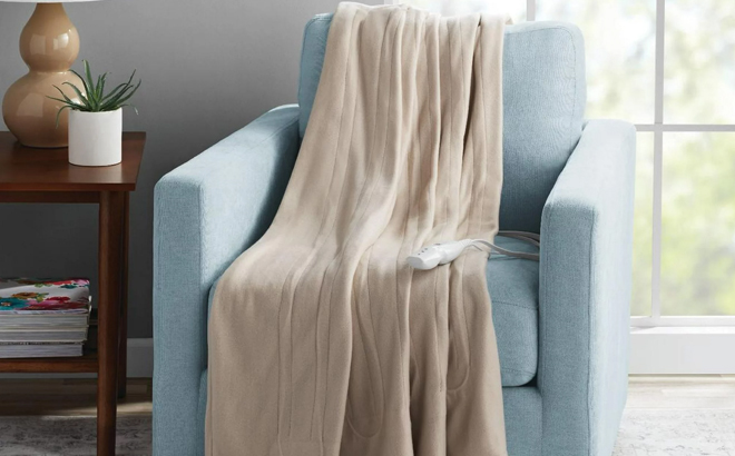 an Image of a Mainstays Fleece Electric Heated Throw Blanket on a Chair